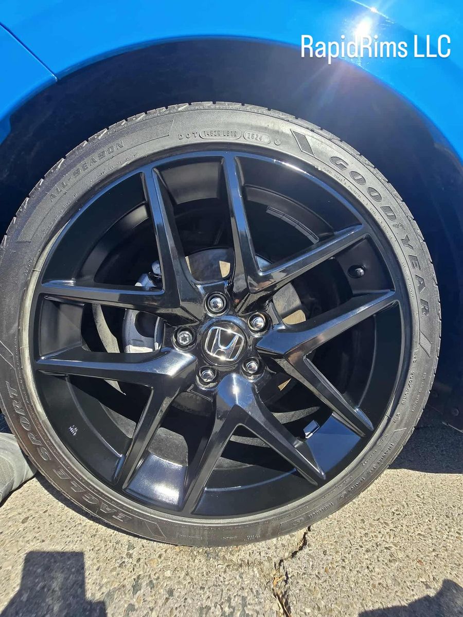 Gloss black Honda wheel after curb rash repair